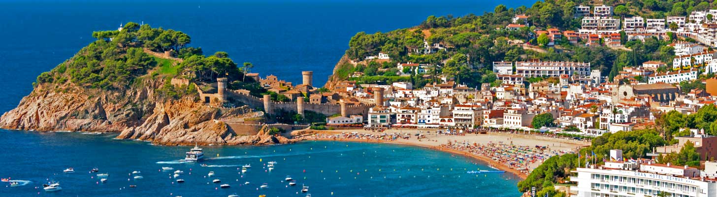Goldens sands & blue waters of beach in Tossa de Mar, Costa Brava