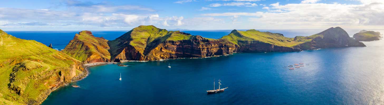Boat in the blue seas of Madeira