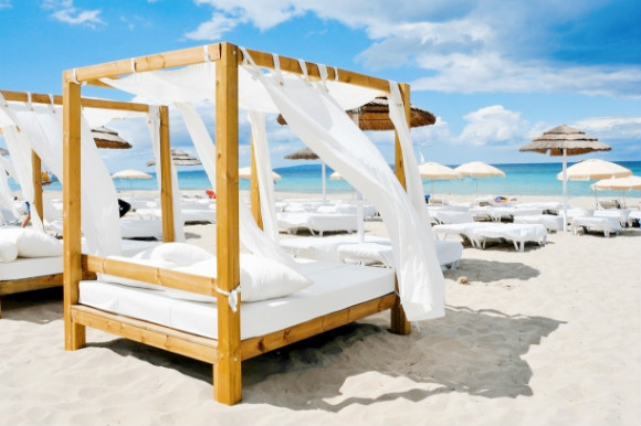 Luxury Balinese beds on the stretches of the bustling resort of Playa den Bossa Ibiza