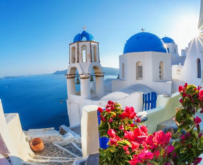 Whitewashed village in Santorini and close up of blue-domed houses in Santorini