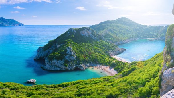 The island of Corfu and its high peaks under the summer sunlight.