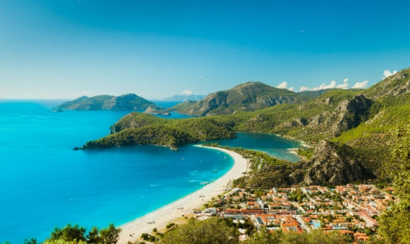 The breathtaking sapphire waters and golden stretch Blue Lagoon in Oludeniz Turkey