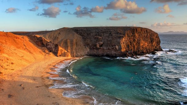 The lunar landscape of Papagayo Beach in Lanzarote and its sapphire waters.