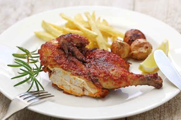 Portugal's famous spicy piri piri chicken dish served with chips