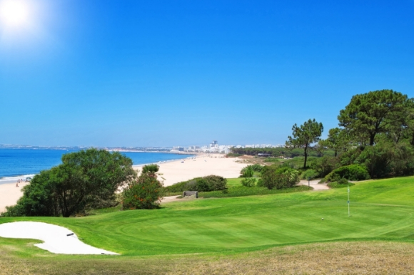 Sunny golf course in Portugal overlooking the Atlantic Ocean