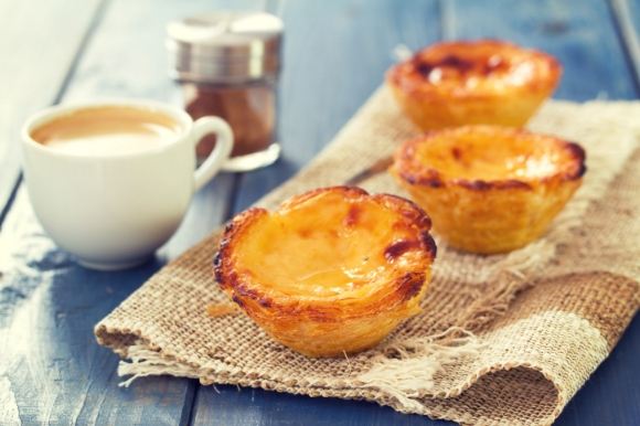 The tasty Portuguese dessert pastel de nata served with a cup of coffee