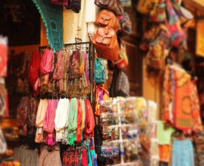 Authentic market stalls and Spanish shops filled with colourful fabrics.