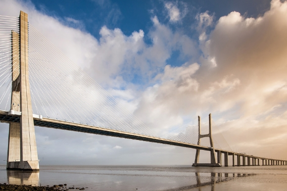 Vasco da Gama Bridge overlooking the Tagus river in Portugal as the sun begins to rise