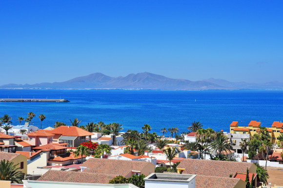 Sunny day in Corralejo Fueteventura with dramatic views of the Lobos Island in the distance