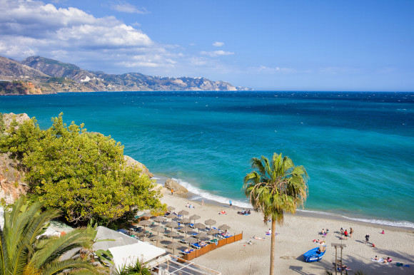 Calahonda Beach in the resort of Nerja, which is part of Spain's Costa del Sol fronted with white sand and backed by greenery
