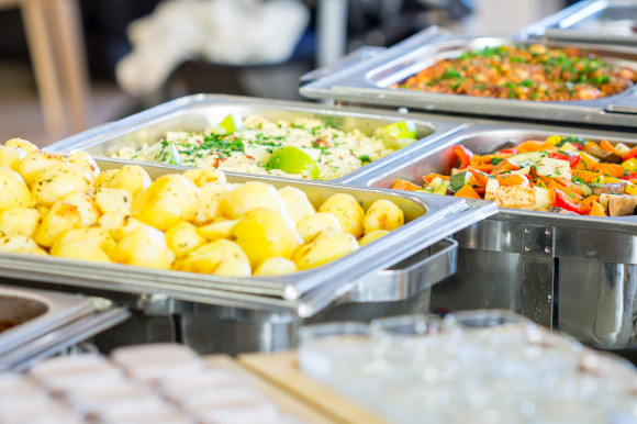 Full Board dining with a hot buffet spread filled with potatoes and vegetable dishes