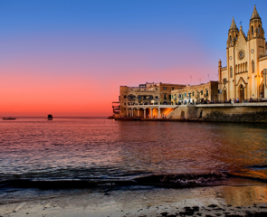 Beautiful sunset view of Spinola Bay, St. Julians and Sliema