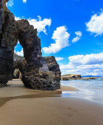 Archways on the beach of Praia de Augas Santas