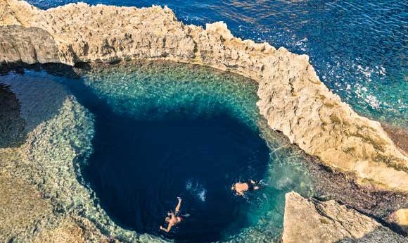 Overhead view of divers at the Blue Hole in Dwejra, Gozo