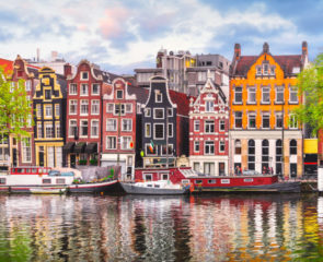 Amsterdam's beautiful coloured town houses overlooking its tranquil canal