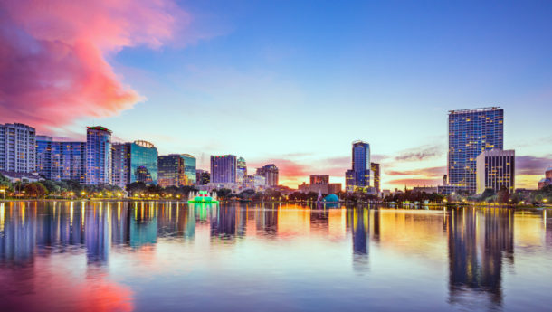 Orlando's Downtown skyline with tall buildings surrounding Eola Lake