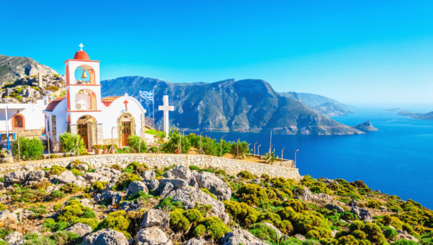 Amazing sea bay on Greek Island with Greek white church