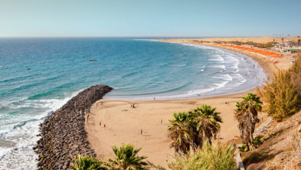 Sandy beach in Playa del Ingles, Gran Canaria, Canary islands, view of the sea, umbrellas, beach, selective focus