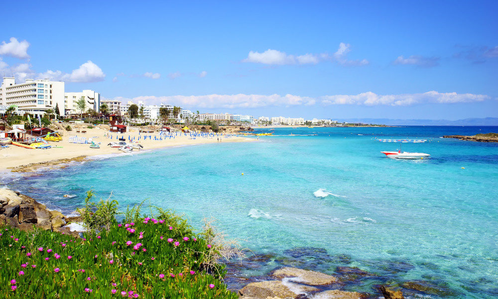 A beautiful view of Fig Tree Bay in Protaras, Cyprus with golden sand and azure waters