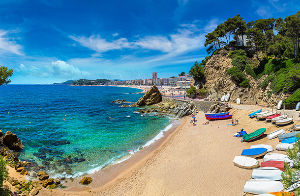 A small bay with boats on the beach in Costa Brava.