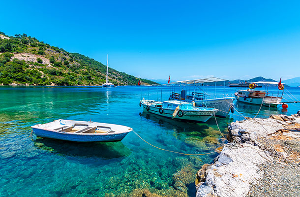 A blue lagoon with boats in Dalaman, Turkey.