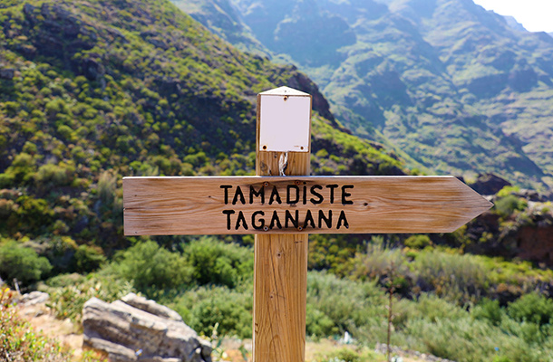 Sign post to Tamadiste and Taganana with hilly backdrop, Tenerife