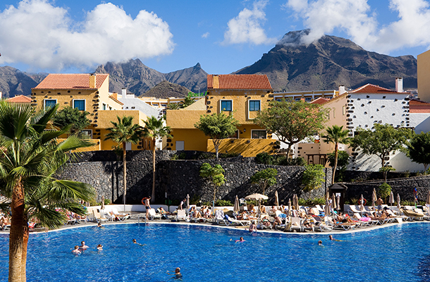 A view of the GF Isabel Hotel pool with mountainous backdrop, Tenerife.