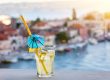 Cocktail with blurred Croatian town in background